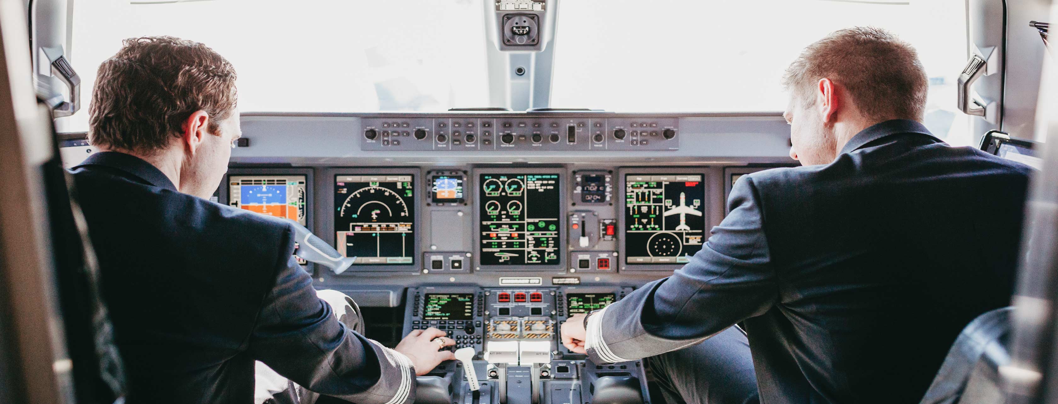 Airline Pilots in Cockpit of ERJ Aircraft