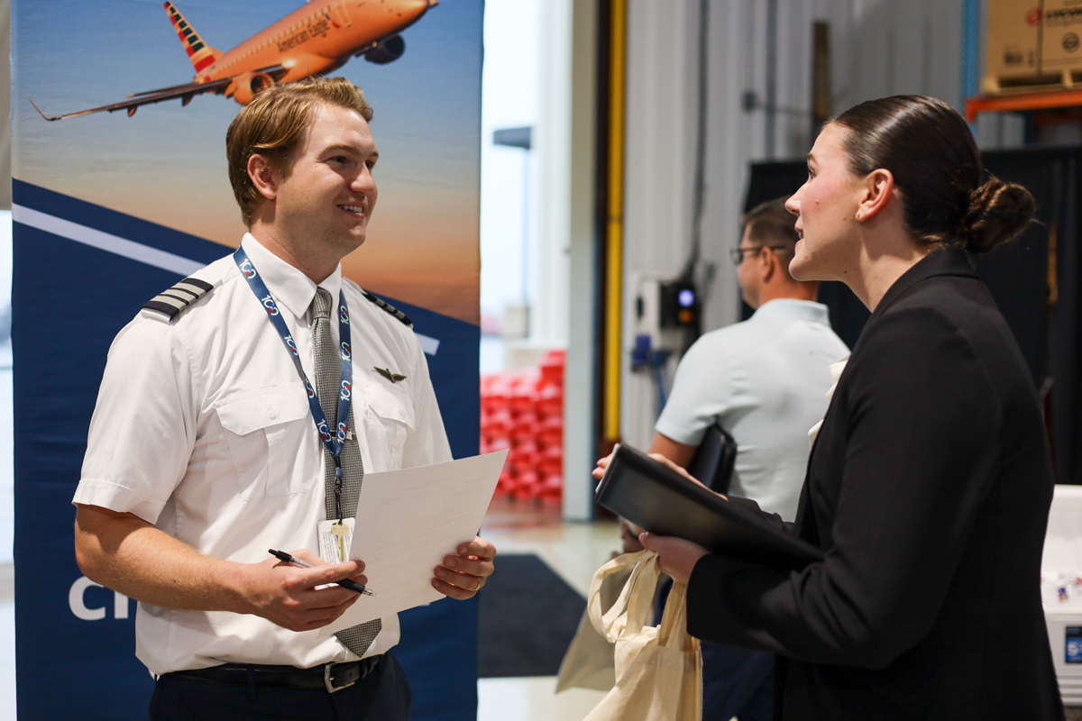 An American Airlines pilot speaks with ATP alumni at the 2026 Career Expo