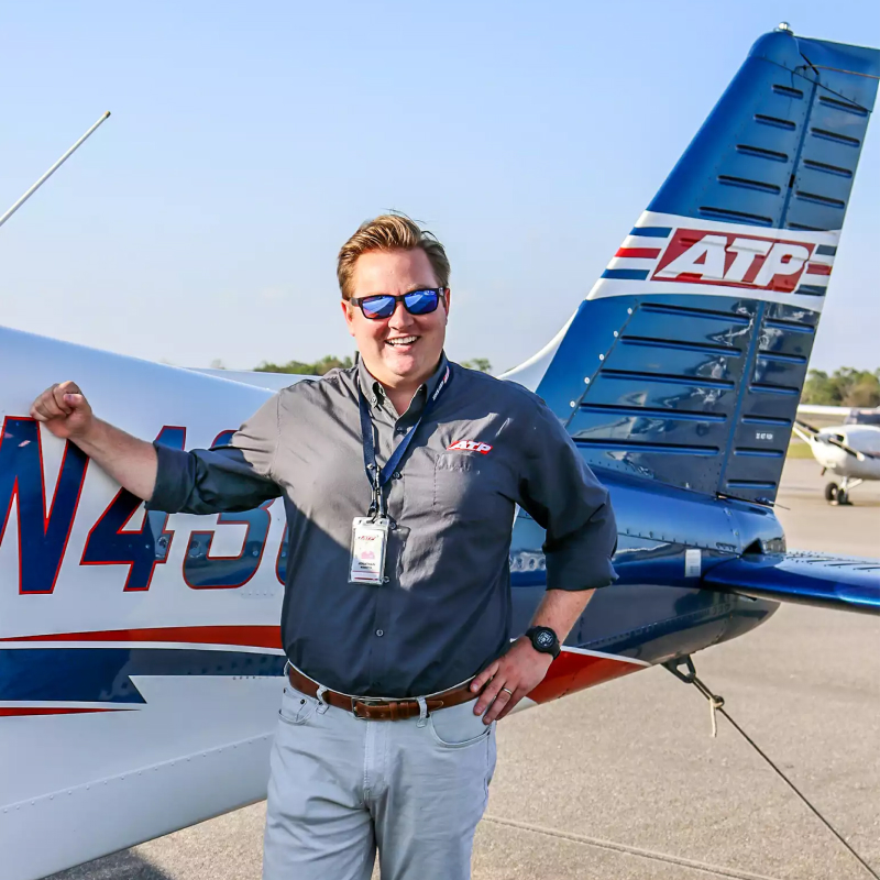 ATP Flight Instructor standing next to aircraft