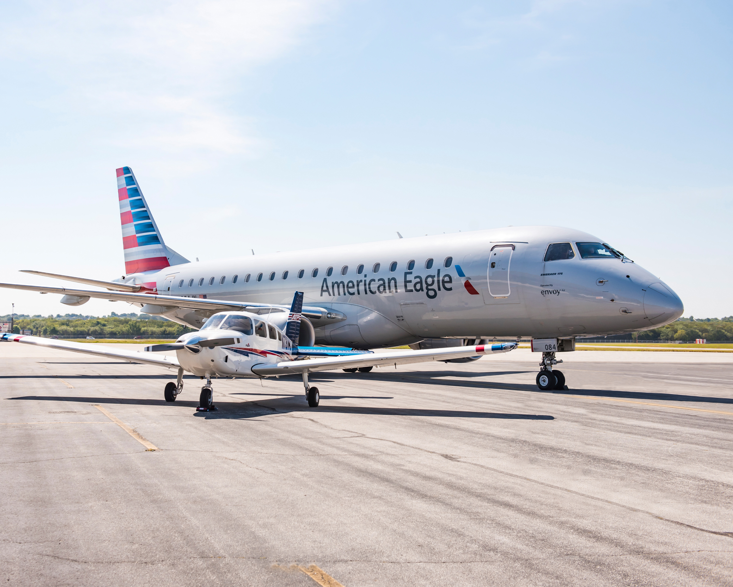 American Eagle and ATP Flight School aircraft parked on the tarmac