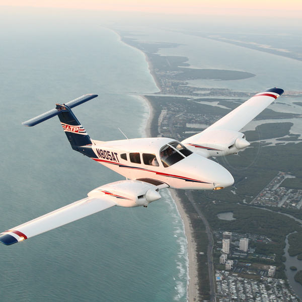 ATP Flight School Piper Seminole training aircraft in flight